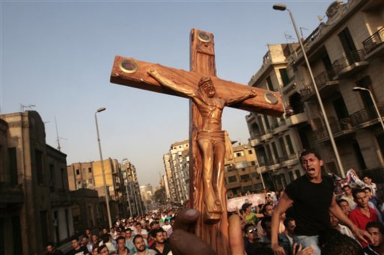 Angry Egyptian Christians protest outside St. Mark's Cathedral against the military ruling council in Cairo, Egypt, Monday, Oct. 10, a day after at least 24 people were killed when Christians, angered by a recent church attack, clashed Sunday night with Muslims and security forces outside the state television building in central Cairo. 